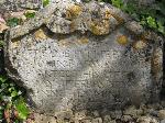 Small, ornate, Cotswold stone headstone